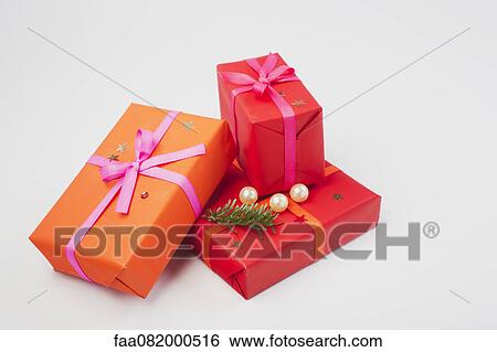Festively wrapped Christmas presents View Large Photo Image Stock Photograph - Festively wrapped Christmas presents. Fotosearch