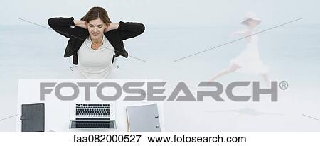 Mature businesswoman sitting at desk, imagining herself at the beach View Large Photo Image Stock Photo - Mature businesswoman sitting at desk, imagining herself at the beach. Fotosearch