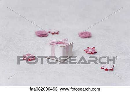 Miniature wrapped gift and paper flowers View Large Photo Image Stock Image - Miniature wrapped gift and paper flowers. Fotosearch