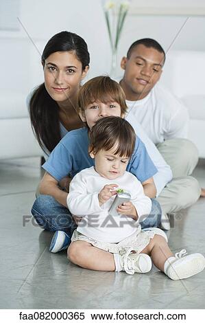 Mother and children sitting on floor at home View Large Photo Image Stock Photography - Mother and children sitting on floor at home. Fotosearch