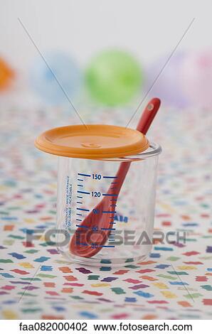 Plastic measuring cup and baby spoon View Large Photo Image Stock Image - Plastic measuring cup and baby spoon. Fotosearch