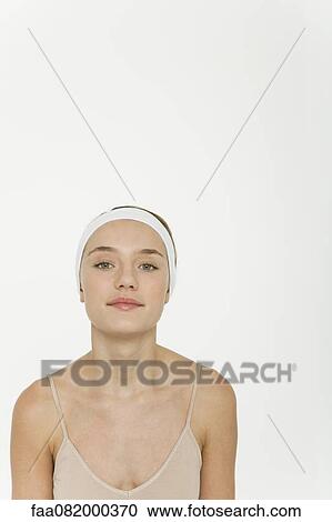 Preteen girl wearing camisole and headband, portrait View Large Photo Image Stock Image - Preteen girl wearing camisole and headband, portrait. Fotosearch