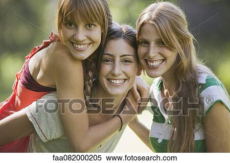 Stock Photography - Smiling young women, portrait. Fotosearch