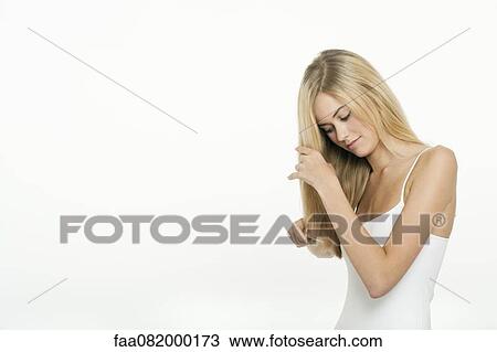 Teen girl combing her hair View Large Photo Image Stock Image - Teen girl combing her hair. Fotosearch