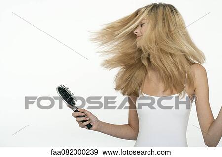Teen girl tossing her hair View Large Photo Image Stock Photo - Teen girl tossing her hair. Fotosearch