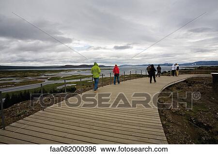 Tourists at Pingvellir (Thingvellir) National Park, Iceland View Large Photo Image Stock Photograph - Tourists at Pingvellir (Thingvellir) National Park, Iceland. Fotosearch