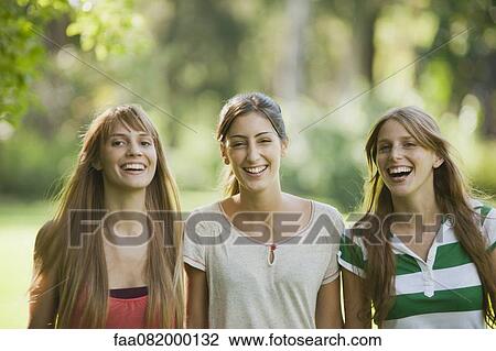 Stock Image - Young women laughing, portrait. Fotosearch