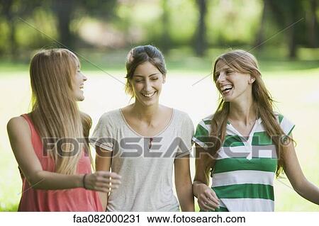 Young women laughing View Large Photo Image Stock Image - Young women laughing. Fotosearch