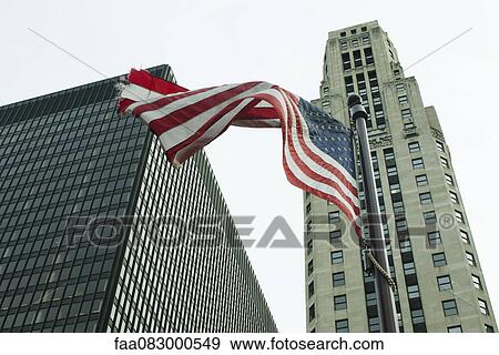 American flag waving in the wind, River North neighborhood, Chicago View Large Photo Image Stock Photo - American flag waving in the wind, River North neighborhood, Chicago. Fotosearch