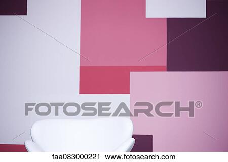 Armchair in front of wall with pink color blocks View Large Photo Image Stock Image - Armchair in front of wall with pink color blocks. Fotosearch