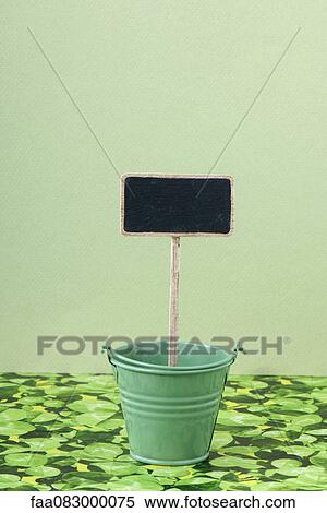 Blank sign in gardening pot View Large Photo Image Stock Photography - Blank sign in gardening pot. Fotosearch