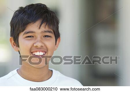 Stock Image - Boy smiling, portrait. Fotosearch