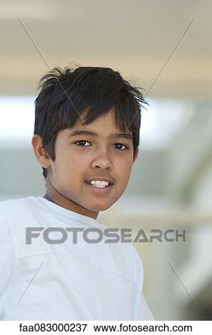 Stock Photo - Boy smiling, portrait. Fotosearch