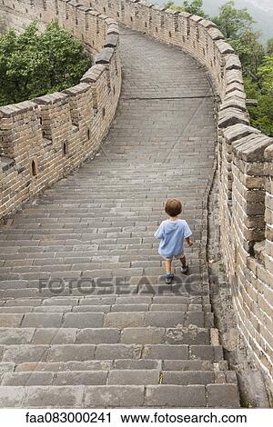 Boy walking on Great Wall of China, China View Large Photo Image Stock Image - Boy walking on Great Wall of China, China. Fotosearch