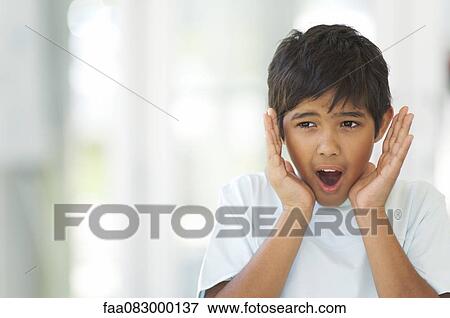 Boy with shocked expression on face View Large Photo Image Stock Photo - Boy with shocked expression on face. Fotosearch