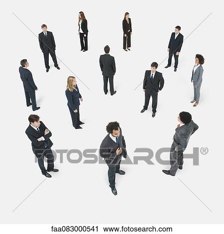 Stock Image - Business executives waiting around, high angle view. Fotosearch