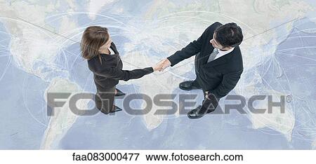 Business professionals engage in global business transactions View Large Photo Image Stock Photo - Business professionals engage in global business transactions. Fotosearch
