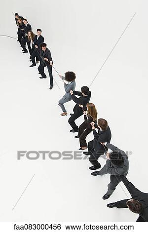 Business professionals in tug-of-war match View Large Photo Image Stock Photograph - Business professionals in tug-of-war match. Fotosearch