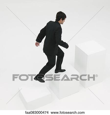 Picture - Businessman ascending steps. Fotosearch