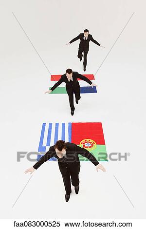 Businessman running across Greek, Portuguese, Italian and French flags View Large Photo Image Stock Photography - Businessman running across Greek, Portuguese, Italian and French flags. Fotosearch