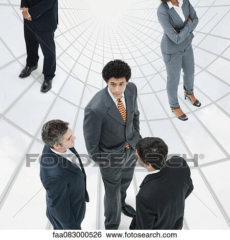 Stock Photograph - Businessman talking with colleagues. Fotosearch
