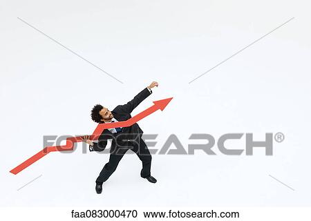 Stock Image - Businessman throwing arrow upward. Fotosearch