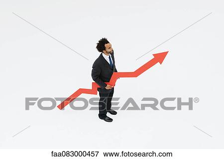 Businessman with arrow pointed upward projecting financial growth View Large Photo Image Stock Photo - Businessman with arrow pointed upward projecting financial growth. Fotosearch