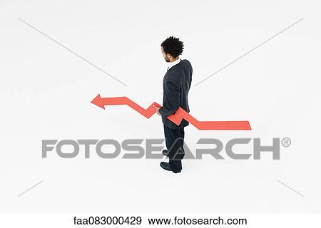 Businessman with arrow projecting uncertain financial future View Large Photo Image Stock Photo - Businessman with arrow projecting uncertain financial future. Fotosearch