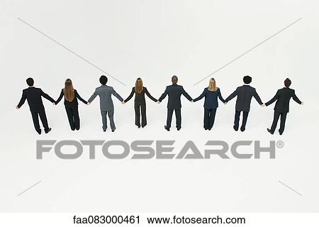 Businessmen and businesswomen standing together holding hands View Large Photo Image Stock Image - Businessmen and businesswomen standing together holding hands. Fotosearch