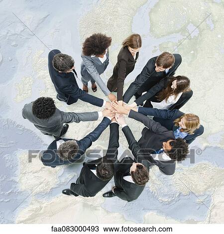 Stock Image - Camaraderie between business associates fosters productive teamwork. Fotosearch