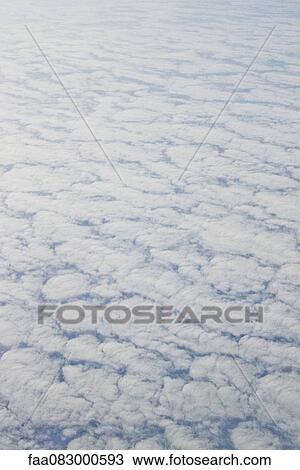 Carpet of clouds seen from a plane View Large Photo Image Stock Image - Carpet of clouds seen from a plane. Fotosearch