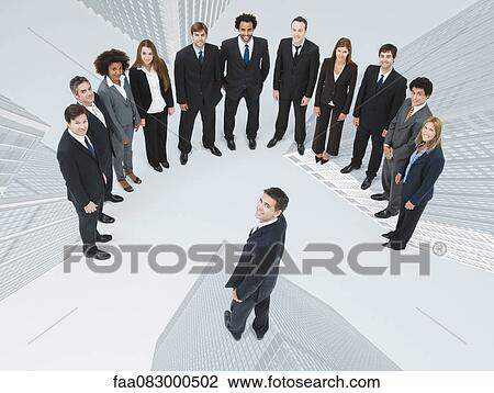 Stock Image - CEO exhibits leadership at meeting with employees. Fotosearch
