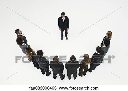 Stock Image - CEO meeting with team of business associates. Fotosearch