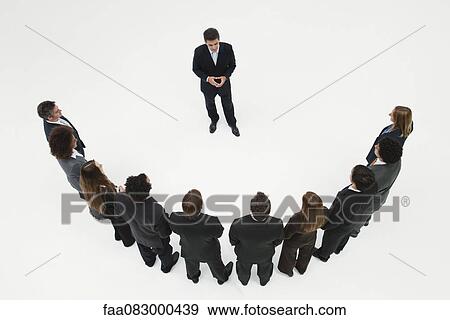 Stock Photo - CEO meeting with team of business associates. Fotosearch