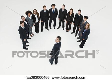 Stock Photograph - CEO meeting with team of business associates. Fotosearch