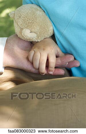 Child's hand holding adult's hand View Large Photo Image Stock Image - Child's hand holding adult's hand. Fotosearch