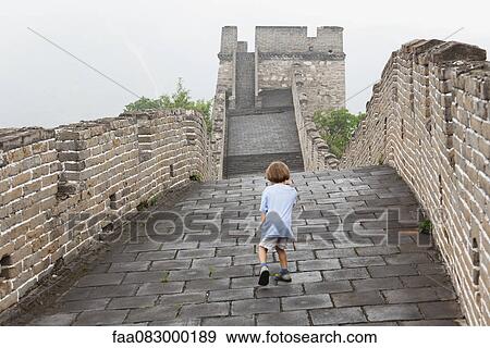 China, boy walking on Great Wall of China View Large Photo Image Stock Photo - China, boy walking on Great Wall of China. Fotosearch