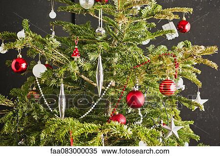 Stock Photography - Christmas ornaments on Christmas tree. Fotosearch