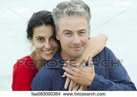 Couple embracing outdoors, portrait View Large Photo Image Picture - Couple embracing outdoors, portrait. Fotosearch