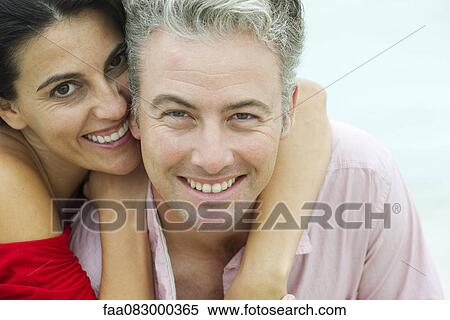 Stock Photography - Couple embracing, portrait. Fotosearch