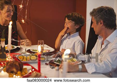 Family having Christmas dinner View Large Photo Image Picture - Family having Christmas dinner. Fotosearch