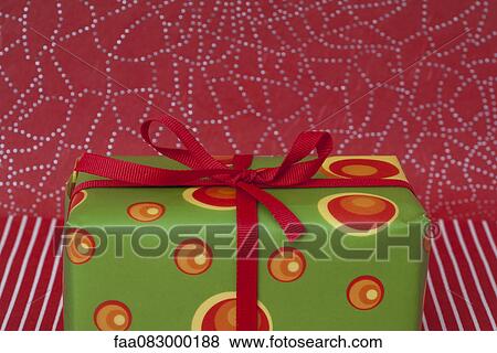 Festively wrapped Christmas present View Large Photo Image Stock Photo - Festively wrapped Christmas present. Fotosearch