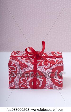 Festively wrapped gift View Large Photo Image Stock Photo - Festively wrapped gift. Fotosearch