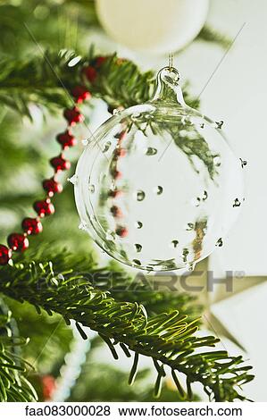 Glass Christmas ornament on tree View Large Photo Image Stock Photo - Glass Christmas ornament on tree. Fotosearch