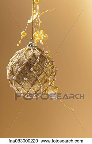 Golden beaded Christmas ornament View Large Photo Image Stock Image - Golden beaded Christmas ornament. Fotosearch