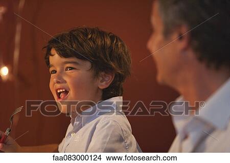 Little boy having meal View Large Photo Image Picture - Little boy having meal. Fotosearch