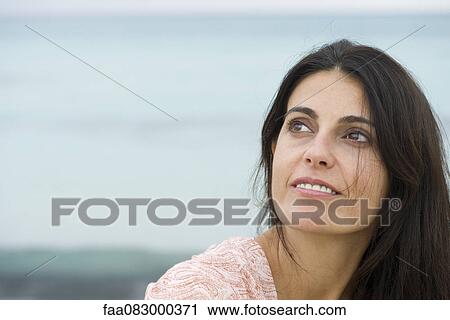 Mature woman looking up in thought, portrait View Large Photo Image Stock Image - Mature woman looking up in thought, portrait. Fotosearch
