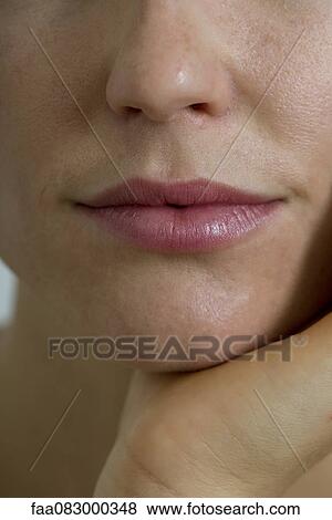 Stock Photo - Mouth of woman, cropped. Fotosearch