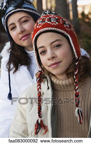 Preteen girl and friend wearing knit hats, portrait View Large Photo Image Stock Image - Preteen girl and friend wearing knit hats, portrait. Fotosearch