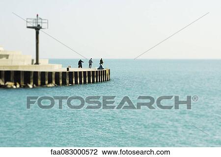 Salmon fishermen on the shores of Lake Michigan, Chicago Lake View View Large Photo Image Stock Image - Salmon fishermen on the shores of Lake Michigan, Chicago Lake View. Fotosearch